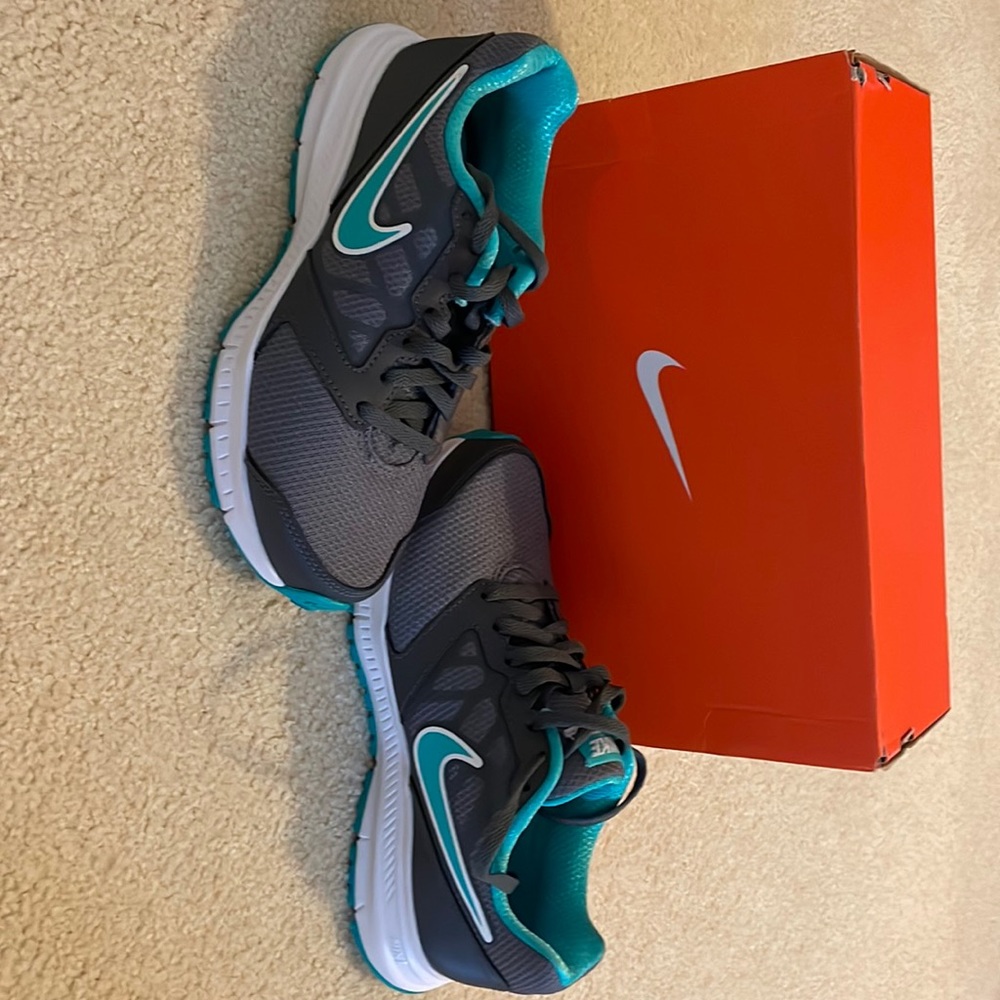 Nike Women’s tennis shoes . Size 6 M Brand New  Gray blue accents
